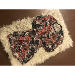 Paisley floral print long-sleeve romper.